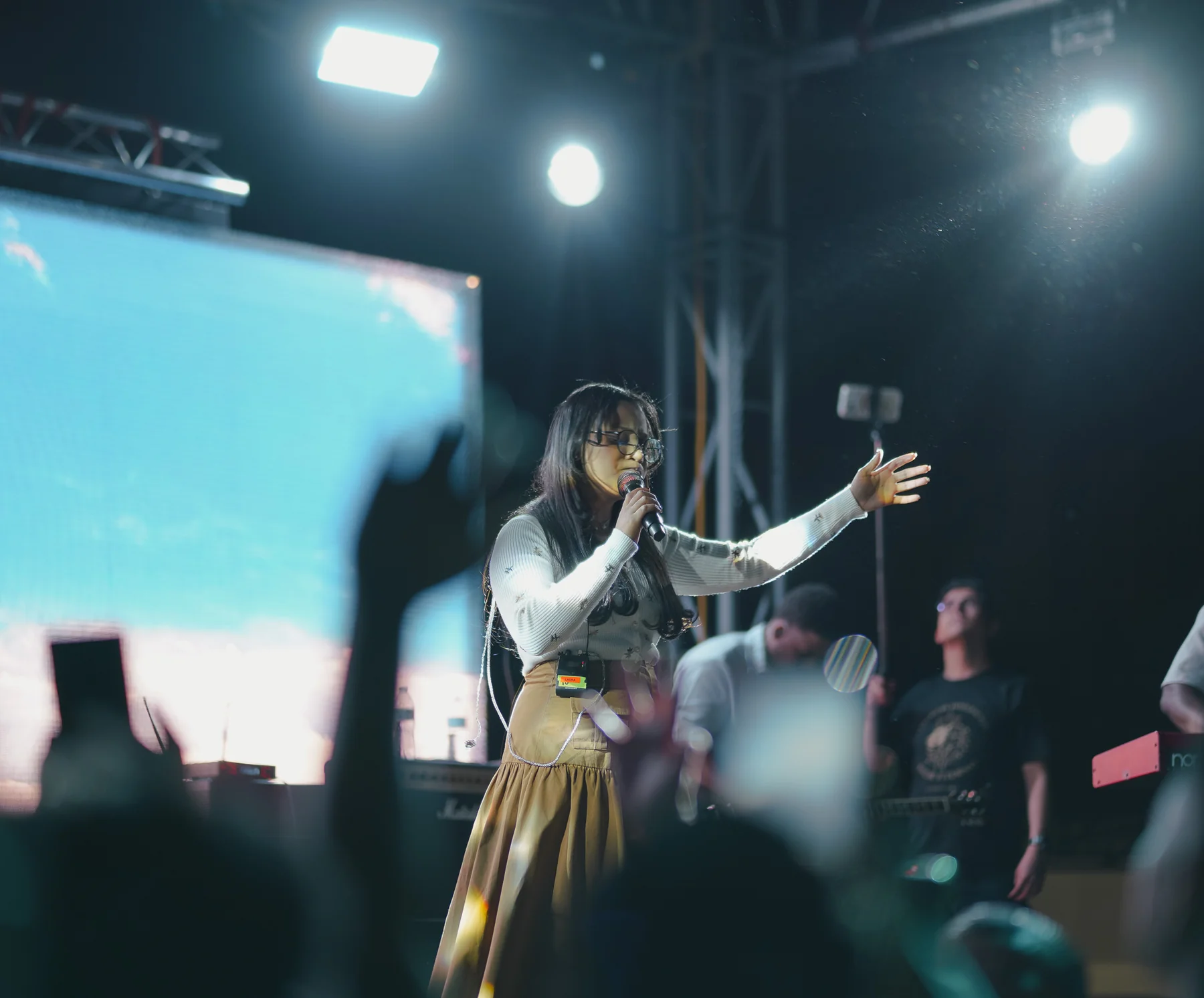 Worship vocalist performing in front of an LED screen
